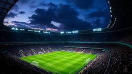 Floodlit Premier League stadium filled with supporters before kick-off